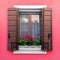 Colorful residential window with blooming flowers in Burano