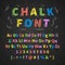 Colorful retro hand drawn alphabet letters drawing with chalk on black chalkboard