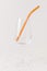 Colorful reusable glass straws in the glass on white background. An alternative replacement for