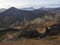 Colorful Rhyolit rainbow mountain panorma with multicolored volcanos and geothermal lake and snow covered peaks. Sunrise