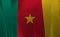 Colorful ribbon as Cameroon national flag, green red and yellow with a star