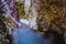 Colorful rocks, water erosion, a small waterfall