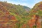 Colorful rocky cliff coast of Madeira with banana plantations