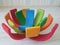 Colorful round stacked rainbow wooden pieces