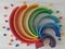 Colorful round stacked rainbow wooden pieces