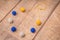 Colorful round wool felt beads necklace handmade with blue, yellow and white color beads on a wood table