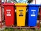 Colorful rubbish bin or trash can in Narathiwat, Thailand. Row of multicolor plastic little bin in public park.