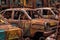 colorful rust patterns on a junkyard cars surface