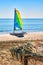 Colorful sailboat catamaran on the sea coast with blue sky