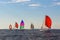 colorful sails under a blue sky