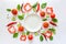 Colorful salad ingredients pattern made of tomatoes, pepper, chili, garlic, cucumber slices, basil and empty plate