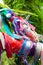 Colorful satin ribbons tied by tourists for good luck. Close-up photo. The background is in the focus