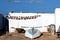 Colorful Scene with dried fish and a Boat in front ATraditional Fishing Hut At A Remote Location On The Canary Islands