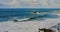 Colorful sea beach, waves foaming and splashing on the rocky shoreline. Ocean waves in open sea at Tenerife north, Anaga