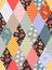 Colorful seamless patchwork pattern of rhombus patches with geometric and floral ornament.