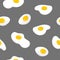 Colorful seamless pattern with fried eggs on gray background. Backdrop with tasty cooked breakfast dish, morning meal