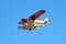 Colorful seaplane landing in vibrant blue sky