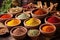 colorful selection of indian spices in wooden bowls