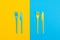 Colorful set of vibrant forks and knife isolated on black