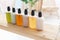 Colorful Shampoo bottles on light wooden table