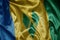 colorful shining big national flag of saint vincent and the grenadines on a silky texture