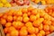 Colorful shiny fresh fruits. Mandarines, tangerine, clementine on the shelf of a supermarket or grocery store