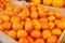 Colorful shiny fresh fruits. Mandarines, tangerine, clementine on the shelf of a supermarket or grocery store