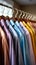 Colorful shirts hanging in a dressing room, neatly washed, ironed