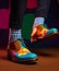 Colorful shoes and socks on mens feet. Generative Ai image