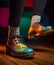 Colorful shoes and socks on mens feet. Generative Ai image
