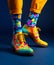Colorful shoes and socks on mens feet. Generative Ai image