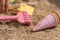 Colorful shovels on the sand at the beach