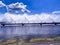 A colorful sight: cooling fountains of the Atomic Station, Heat of a power plant against a background of white clouds, blue sky