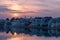 Colorful sky and clouds over Pushkar, Rajasthan, India. Temples, buildings and colors reflecting on the holy water of the lake at