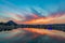 Colorful sky and clouds over Pushkar, Rajasthan, India. Temples, buildings and colors reflecting on the holy water of the lake at