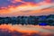 Colorful sky and clouds over Pushkar, Rajasthan, India. Temples, buildings and colors reflecting on the holy water of the lake at