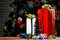 Colorful small and big present gift boxes with shiny ribbon bow tie placed on corner of wooden table in front fully decorative bea