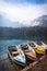 Colorful small boats in lake Laghi di Fusine near Tarvisio