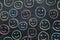 Colorful smileys on chalkboard background