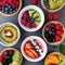 A colorful smoothie bowl topped with fresh fruits and nuts2