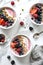 Colorful smoothie bowls topped with fresh berries and granola, AI Generated.