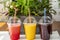 Colorful smoothie cocktails - blueberry smoothie, watermelon smoothie and orange smoothie, fresh and organic ingredients
