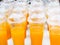 Colorful smoothy mandarin orange or tangerine fruit juice in white plastic glass