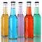 Colorful soda and soft drinks in bottles with reflection