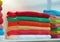 colorful soft fabric turkish bath cloth on the shopping shelf aka rack, textile pack, colors diversity,