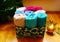 Colorful and soft towels rolled and lined in the modern carton box in the cozy indoor space