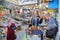 The colorful souk inside the medina of Sfax, with a focus on a craftsman and his tools