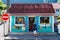 Colorful souvenir and fruit shop building at the town of Fond de Rond Point in Saint-Denis De La Reunion, France.