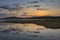 Colorful, spectacular sunset over Balkan mountain and artificial lake Jrebchevo. Last rays of light.