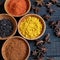 Colorful spice powder, chilli, pepper, turmeric, cashew